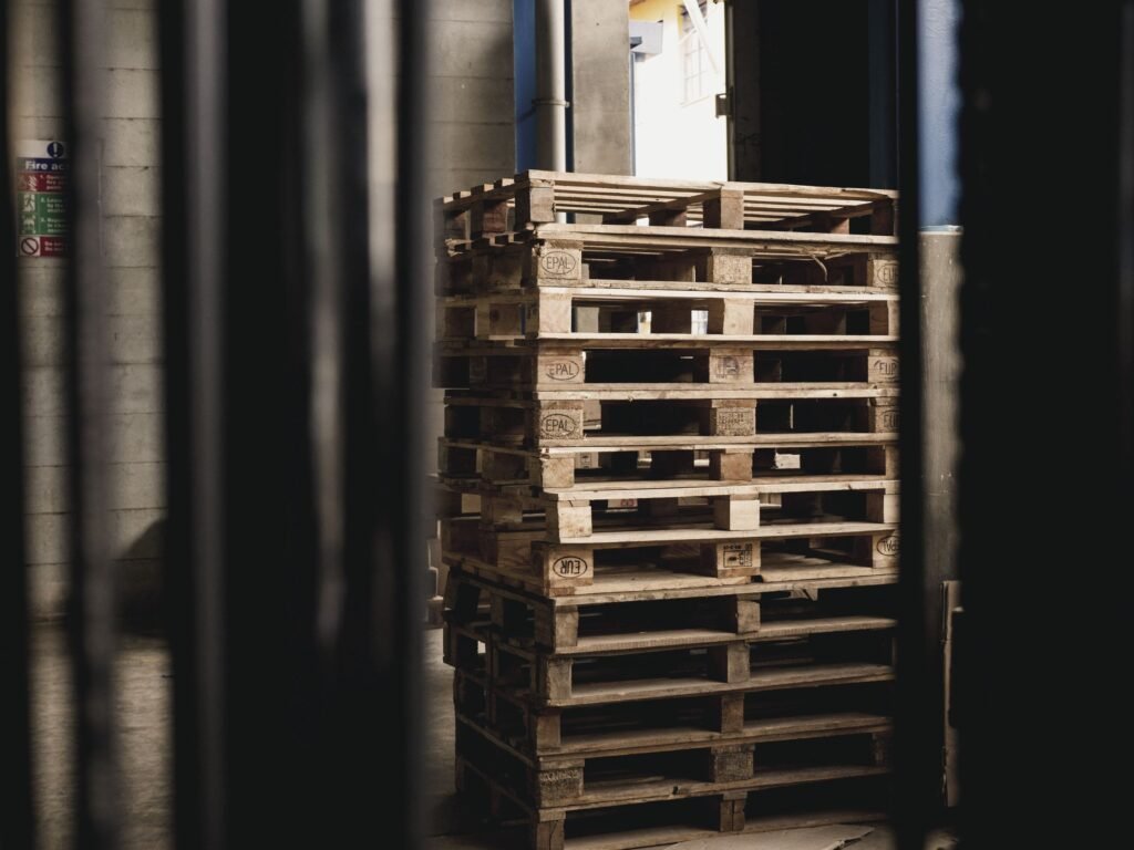 Stack of wooden pallets in a warehouse